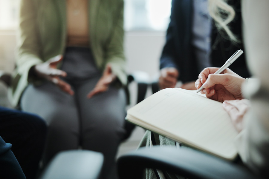 T2P Recruitment specialists in the UK taking notes for HR, Finance, Supply Chain and Executive Office function roles in the UK