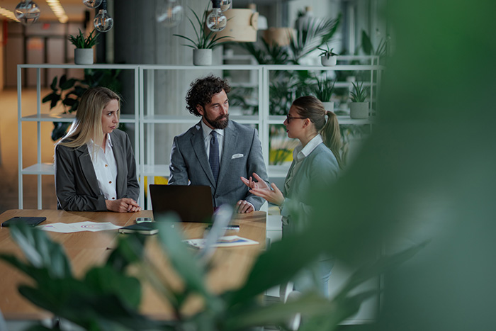 Business professionals in a modern office, representing T2P Recruitment’s focus on mid-senior roles